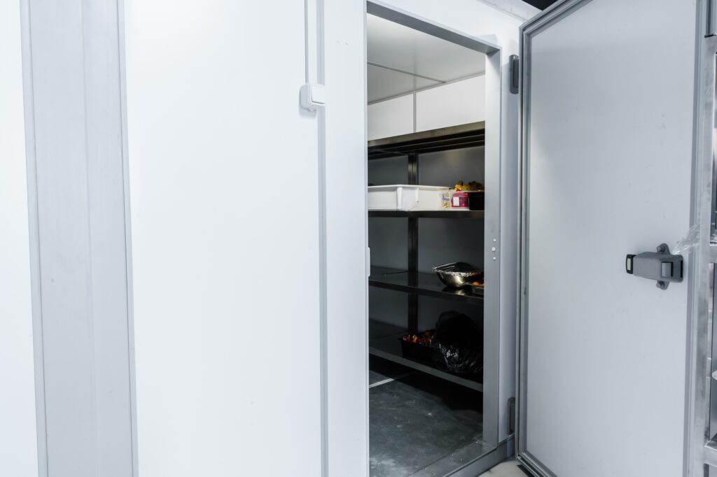 Refrigerator room door in professional kitchen in restaurant
